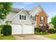 Charming two-story home with a two-car garage and well-maintained lawn at 3471 Chastain Glen Ne Ln, Marietta, GA 30066