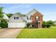 Well-maintained two-story home with a two-car garage and manicured landscaping at 3471 Chastain Glen Ne Ln, Marietta, GA 30066
