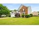 Inviting two-story home with brick accents, a two-car garage, and mature landscaping at 3471 Chastain Glen Ne Ln, Marietta, GA 30066