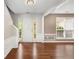 Welcoming foyer featuring hardwood floors, white wainscoting, and a view into the living and dining areas at 3471 Chastain Glen Ne Ln, Marietta, GA 30066