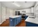 Spacious kitchen features a large island, stainless steel appliances, white counters and two-tone cabinets at 3471 Chastain Glen Ne Ln, Marietta, GA 30066