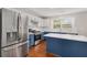 Spacious kitchen featuring an island with quartz countertops, stainless steel appliances, and hardwood floors at 3471 Chastain Glen Ne Ln, Marietta, GA 30066