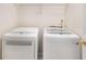 Laundry room features modern side-by-side washer and dryer at 3471 Chastain Glen Ne Ln, Marietta, GA 30066