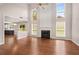 Spacious living room featuring a fireplace, hardwood floors, and tall ceilings with large windows at 3471 Chastain Glen Ne Ln, Marietta, GA 30066