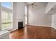 Bright living room featuring a fireplace, hardwood floors, tall ceilings, and large windows at 3471 Chastain Glen Ne Ln, Marietta, GA 30066