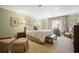 Bright bedroom with floral accents, large bed, and matching curtains at 45 Paces West Nw Dr, Atlanta, GA 30327