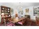 Well-appointed dining room featuring a fireplace, chandelier, and wooden table with seating at 45 Paces West Nw Dr, Atlanta, GA 30327