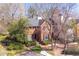 Attractive two-story brick home with manicured landscaping, mature trees, and a well-kept lawn at 45 Paces West Nw Dr, Atlanta, GA 30327