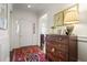 Bright foyer with hardwood floors, elegant dresser, and natural light from the front door at 45 Paces West Nw Dr, Atlanta, GA 30327