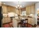 Charming kitchen featuring custom cabinetry, granite countertops, and a lovely chandelier at 45 Paces West Nw Dr, Atlanta, GA 30327