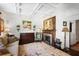 Elegant living room featuring a coffered ceiling, fireplace, and large windows at 45 Paces West Nw Dr, Atlanta, GA 30327