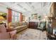 Elegant living room featuring a coffered ceiling, fireplace, and large windows at 45 Paces West Nw Dr, Atlanta, GA 30327