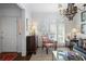 Inviting living room featuring shuttered windows, a chandelier, and stylish furnishings at 45 Paces West Nw Dr, Atlanta, GA 30327