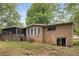 Backyard featuring a screen porch and sliding glass doors to the basement at 4701 Riverwood Cir, Decatur, GA 30035