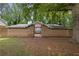 Brick exterior with stone detail and gated entry exudes curb appeal at 4701 Riverwood Cir, Decatur, GA 30035