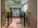 A decorative black metal gate leads to the front door at 4701 Riverwood Cir, Decatur, GA 30035