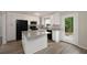 Well-lit kitchen with white cabinetry, granite countertops, island, and black appliances at 4701 Riverwood Cir, Decatur, GA 30035