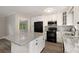 Updated kitchen featuring granite countertops, white cabinets, and stainless steel appliances at 4701 Riverwood Cir, Decatur, GA 30035