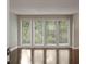 Bright living room features gleaming hardwood floors and large windows at 4701 Riverwood Cir, Decatur, GA 30035