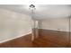 Spacious living room boasts gleaming hardwood floors and neutral paint at 4701 Riverwood Cir, Decatur, GA 30035
