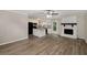Open concept living room features a fireplace and adjacent kitchen at 4701 Riverwood Cir, Decatur, GA 30035