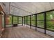 View of the screened porch featuring hardwood floors and natural light at 4701 Riverwood Cir, Decatur, GA 30035