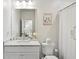 Clean, bright bathroom with marble vanity and shower with white subway tile at 584 Bismark Ne Rd, Atlanta, GA 30324