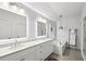 Bright bathroom with a soaking tub, glass shower, and double sink vanity at 584 Bismark Ne Rd, Atlanta, GA 30324