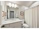 Updated bathroom featuring a sleek vanity, framed mirror and shower with curtain at 584 Bismark Ne Rd, Atlanta, GA 30324