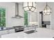 Well-appointed kitchen featuring stainless steel appliances, white cabinetry, and sleek countertops at 584 Bismark Ne Rd, Atlanta, GA 30324