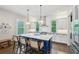 Stylish kitchen island with seating, pendant lighting, and modern appliances at 584 Bismark Ne Rd, Atlanta, GA 30324