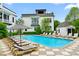 Community pool with lounge chairs and umbrellas surrounded by well-maintained buildings and landscaping at 584 Bismark Ne Rd, Atlanta, GA 30324