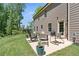 Spacious outdoor patio with seating, perfect for enjoying a barbecue in the privacy of a fenced yard at 165 6Th St, Auburn, GA 30011