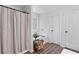 Bathroom with a shower and tub combo, wood look flooring, and white cabinets at 165 6Th St, Auburn, GA 30011