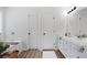 Bright bathroom features modern fixtures, double doors, and a soaking tub at 165 6Th St, Auburn, GA 30011