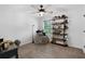 Comfortable bedroom with ceiling fan, cozy beanbag chair, and stylish bookshelf for decor at 165 6Th St, Auburn, GA 30011