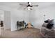 Bedroom featuring ceiling fan, desk, and cozy beanbag chair, creating a relaxing space at 165 6Th St, Auburn, GA 30011