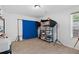Bright bonus room with storage shelves, equipment, and neutral carpet, perfect for hobbies at 165 6Th St, Auburn, GA 30011