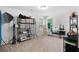 Versatile bonus room with ample space, natural light, and storage racks for organization at 165 6Th St, Auburn, GA 30011