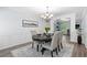 Inviting dining room with elegant wainscoting, modern lighting, and stylish decor, creating sophisticated ambiance at 165 6Th St, Auburn, GA 30011