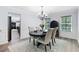 Formal dining room featuring wainscoting, chandelier, and windows allowing for lots of natural light at 165 6Th St, Auburn, GA 30011