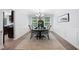 Dining room displaying wainscoting, a dark wood table, an area rug, and a black storage cabinet at 165 6Th St, Auburn, GA 30011