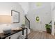 Bright entryway with high ceilings, decorative door, and a wooden staircase with black iron spindles at 165 6Th St, Auburn, GA 30011