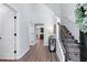 Welcoming foyer features hardwood floors, a staircase with decorative iron spindles, and neutral paint colors at 165 6Th St, Auburn, GA 30011
