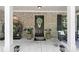 Charming covered front porch with brick accents and ample space for rocking chairs and plants at 165 6Th St, Auburn, GA 30011