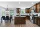Modern kitchen with stainless steel appliances, granite countertops, and a central island at 165 6Th St, Auburn, GA 30011