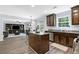 Open kitchen layout featuring a center island, stainless steel appliances, and direct view into the living room at 165 6Th St, Auburn, GA 30011