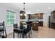 Eat-in kitchen showcases granite counters, recessed lighting, stainless appliances and a dining area near a large window at 165 6Th St, Auburn, GA 30011
