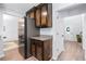 Modern kitchen view showcases stainless steel refrigerator and appliances plus custom cabinets and granite countertops at 165 6Th St, Auburn, GA 30011