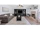 Comfortable living room boasts custom built-ins, a brick fireplace, and a cozy sofa for relaxation and entertaining at 165 6Th St, Auburn, GA 30011